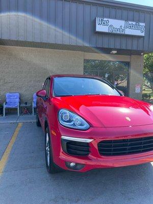 A beautiful red Porsche cayenne after an Exterior Detail