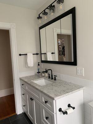 Large white subway tile around entire bathroom