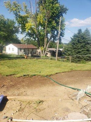 Filled in pool area and resod .