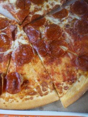 Cheese,Tomato sauce,and Pepperoni is missing near the crust of the pizza. As seen in this photo.