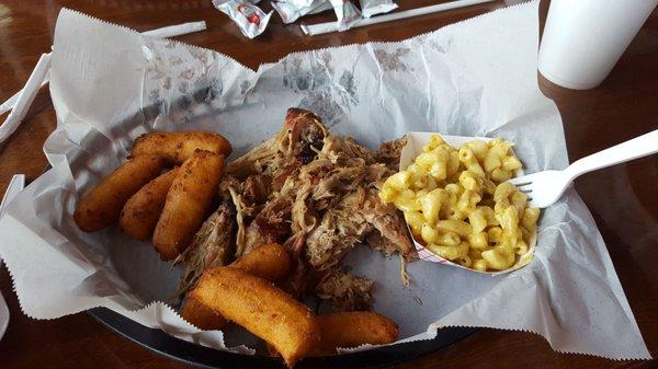 It is pulled pork and barbeque macncheese and hushpuppys