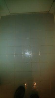 Before cleaning, this blue tile had awful yellowing in the grout.