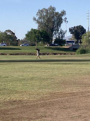 this homeless man's dog (pit bull) ran across the golf course to harass my dog, trying to dominate him and hump him.