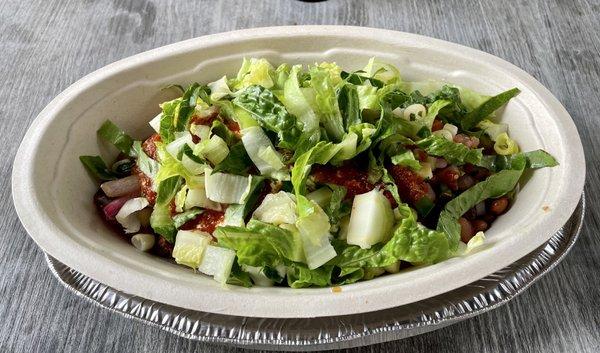 Steak bowl, pinto beans, pick, salsa, sour cream and lettuce.