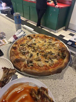 Sausage, mushroom & onion pizza.  Hot Wings