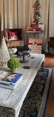 Custom suede chairs, tapestry used as rug.