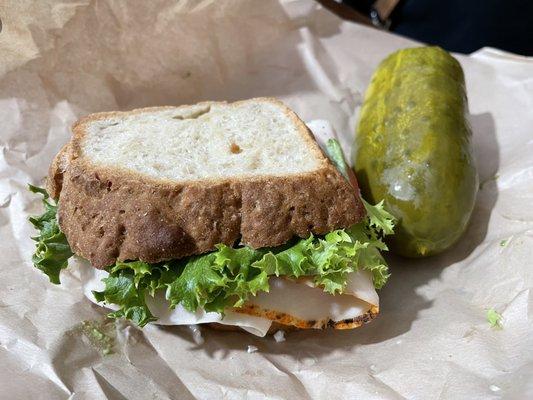 Half sandwich and a pickle