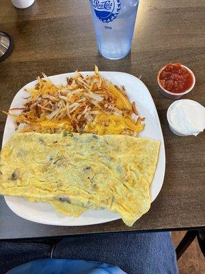 Spinach, Mushroom, Swiss omelette with side of salsa and sour cream......hash browns with cheese.