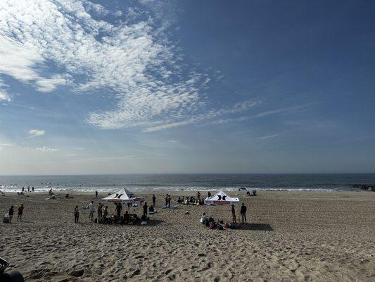 Kids sitting and all quietly listening at Surf Camp!