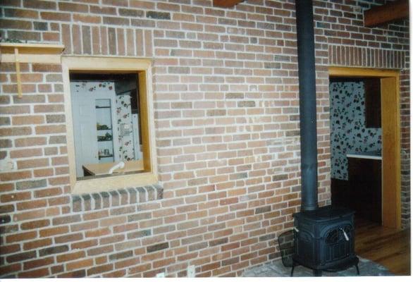 Old brick wall into kitchen space was removed from old sink window to door and a great opening added from the sunroom back in...