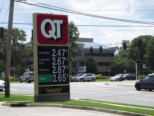 Street sign with gas prices at corner of Peachtree Industrial and Abbotts Bridge.