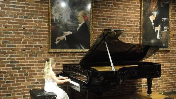 Students performing at the Steinway Gallery on Mission.