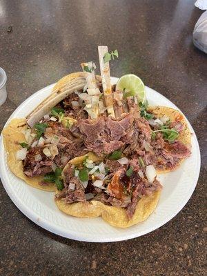 Tacos de birria with fire chili oil y consomé