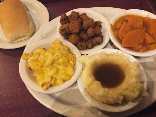 Yeast roll, Mac and cheese, fried okra, mashed potatoes and gravy, and yams!