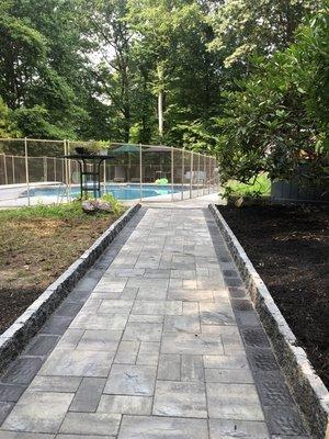 Beautiful walkway Onyx natural and coal border with Cambridge block curb