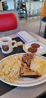 11/22/2024 Classic two egg breakfast egg scrambled add cheese Went with the double hash browns scattered light  Sausage cawfee