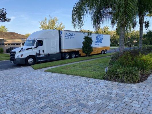 The truck, crew and all our stuff arriving ahead of schedule.