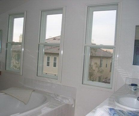 Wall of windows with Sound Proof Window Treatments flush mounted enclosing them.