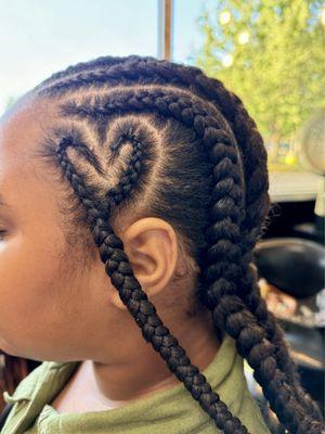 Heart cornrows with hair added in.