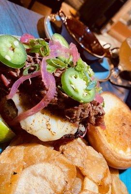 Big Stupid Burger- A Birria Burger- topped with Short Ribs and a side of Birria dipping consome.