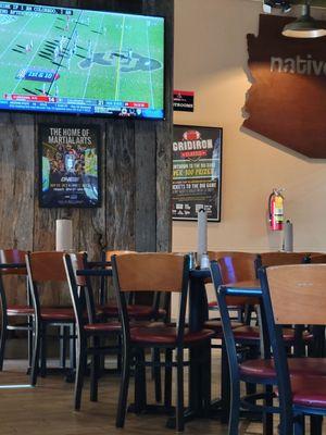 Restaurant interior with UofA game on.