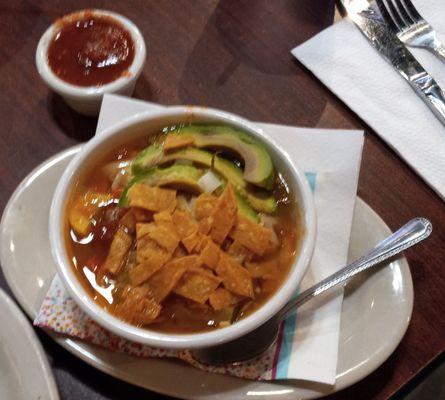 Small Tortilla Soup with vegetables, shredded chicken, cheese, avocado and crispy tortilla strips. $8