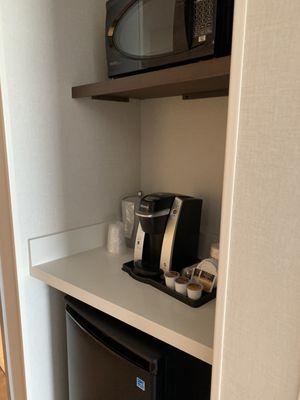 Microwave, small refrigerator and coffee pot. You can go to the desk and ask for real cream