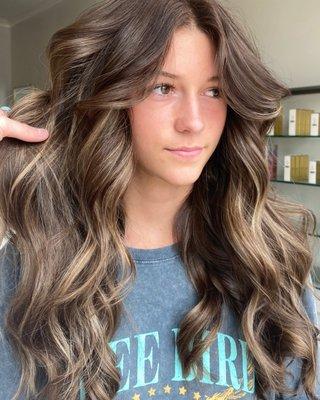 Baylaged pops of blonde in her natural brown 
Stylist Deana Kale