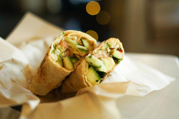 Veggie Delight - Grilled zucchini, squash, cauliflower, tomatoes, onions, red peppers, sumac, pomegranate molasses, and hummus.