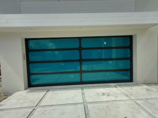 ES Glass Garage Door.  Black frame lo-e glass frosted.