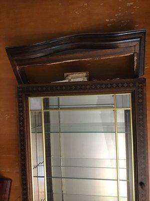 Top of antique curio cabinet completely broken off