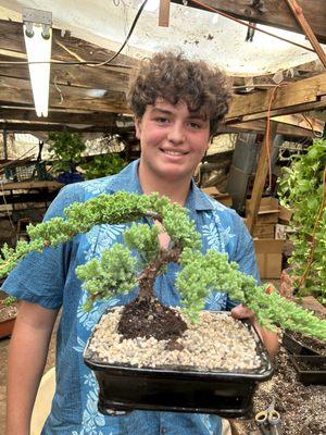 Max (staff at Sunshine Miniature Trees) and the juniper bonsai we selected.