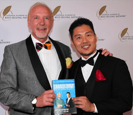 Dr. Yoo receiving the Quilly Award for "Transform" from the National Academy of Best-Selling Authors, celebrating with Mark Victor Hansen