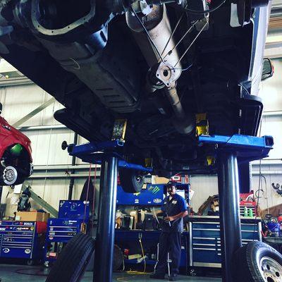 Service Tech, Gabriel Carrera is working on a truck that's on his lift! =))