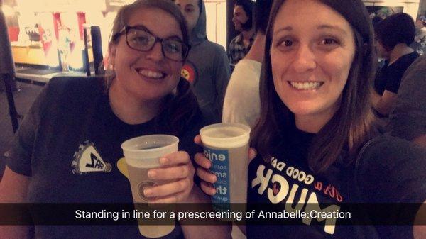 Drinking beer while we're in line for a movie screening