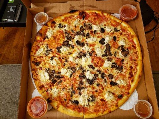 Whole pizza with mushroom and ricotta with sides of marinara and hot honey