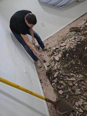 Basement floor being demolished and re poured