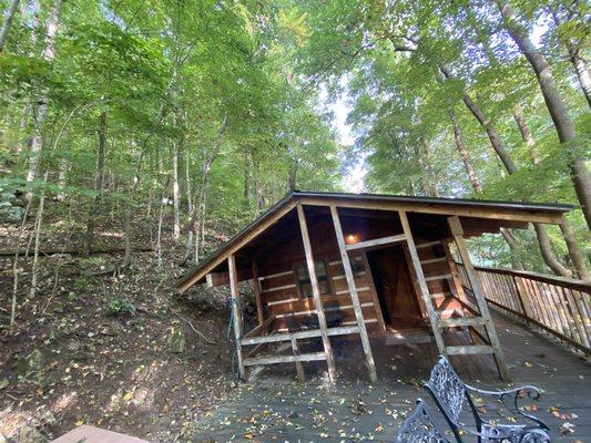 View of cabin #13 from deck near hot tub.