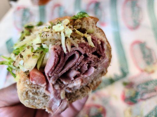 12 inch roast beef on wheat bread with provolone, lettuce, tomatoes, onion, mayo, oregano, and pepper.