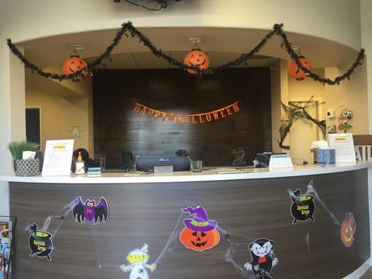 Cute front desk, all decorated for Halloween.