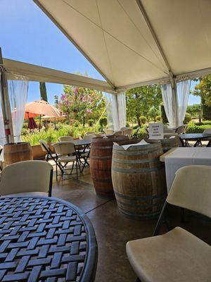 The outdoor seating in a very large tent