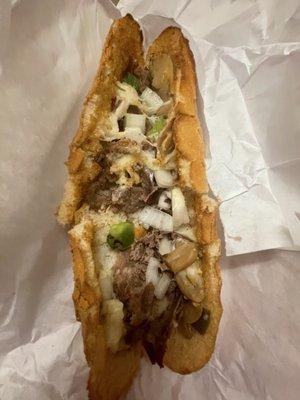 Alleged cheesesteak with raw onions and green peppers!!!!!