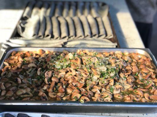 Fresh cooked mushrooms next to our blue corn quesadillas. Ready to serve our customers.