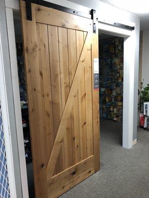 Simpson Brand Knotty Alder Barn Door on display in our showroom