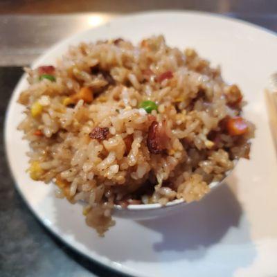 The fried rice is made with bacon, which is tasty