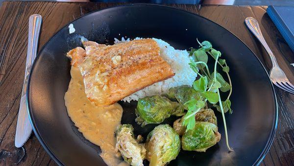 Seared salmon with red curry sauce.