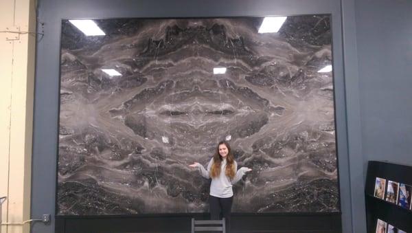 Beautiful book-matched slabs on display in their waiting area.