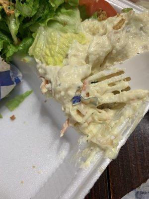 Sandwich wrapper mixed into the potato salad.