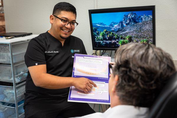 Dr. Jaramillo talking to patient about implants