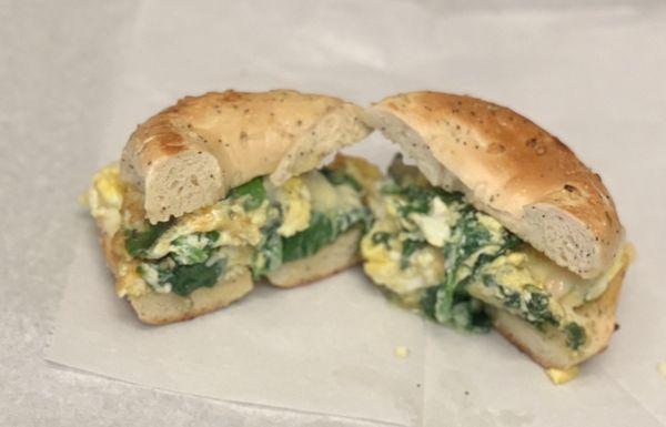 Egg on a bagel with spinach and swiss!